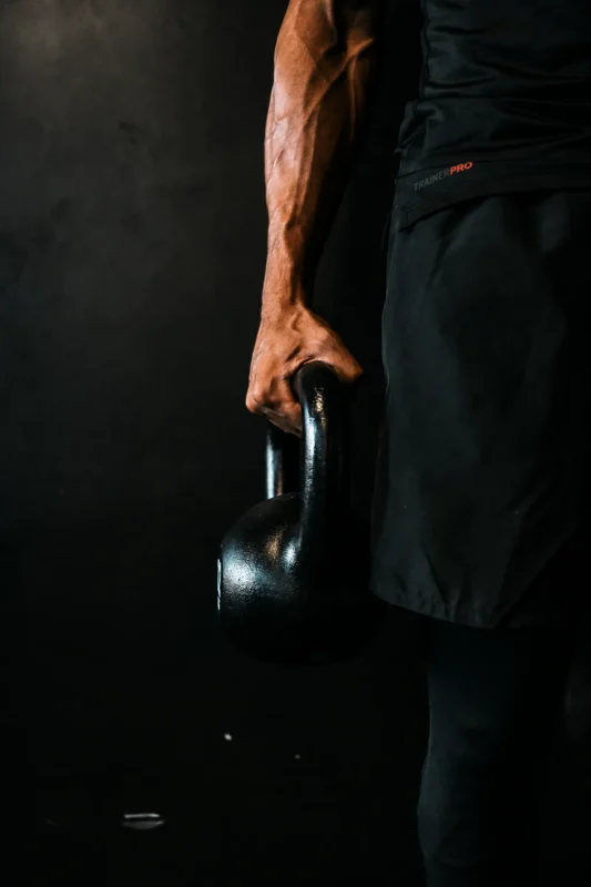Trainer Pro coach guiding a client through a barbell squat