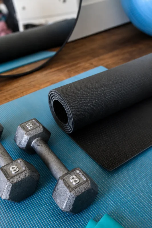Personal trainer coaching a squat in Etobicoke